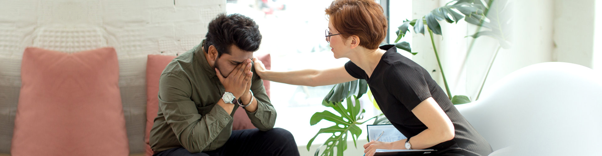 woman helping her patient to calm down on a counseling session